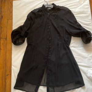 Black see-through polyester women’s top.